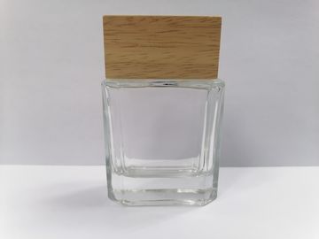 garrafas de perfume 50ml de vidro com a composição transparente do tampão de madeira que empacota a vários cor e imprimir