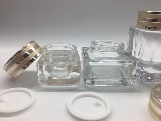 Os frascos de vidro do quadrado pequeno clássico luxuoso galvanizam a impressão com tampão metálico