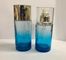 As garrafas de creme cosméticas de vidro azuis/garrafa recarregável da bomba personalizaram o logotipo e a cor
