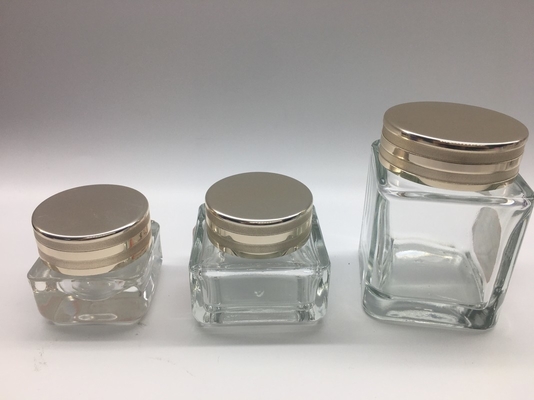 Os frascos de creme de vidro do quadrado pequeno galvanizam a impressão com tampão metálico