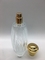 As garrafas de perfume 100ml vazias altas luxuosas frisam o pulverizador com o tampão redondo do ouro